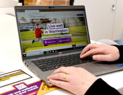 Living Well Warrington Online on a laptop